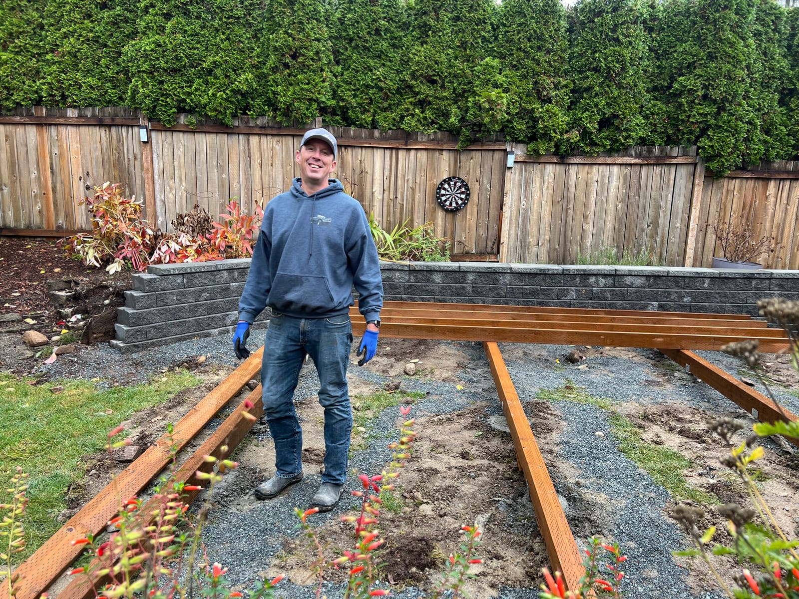 Got a Guy Projects owner building a cedar deck in a Redmond backyard